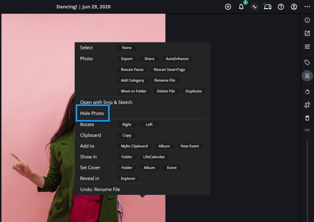 A photo open with the right-click menu showing and "Hide Photo" outlined in blue.