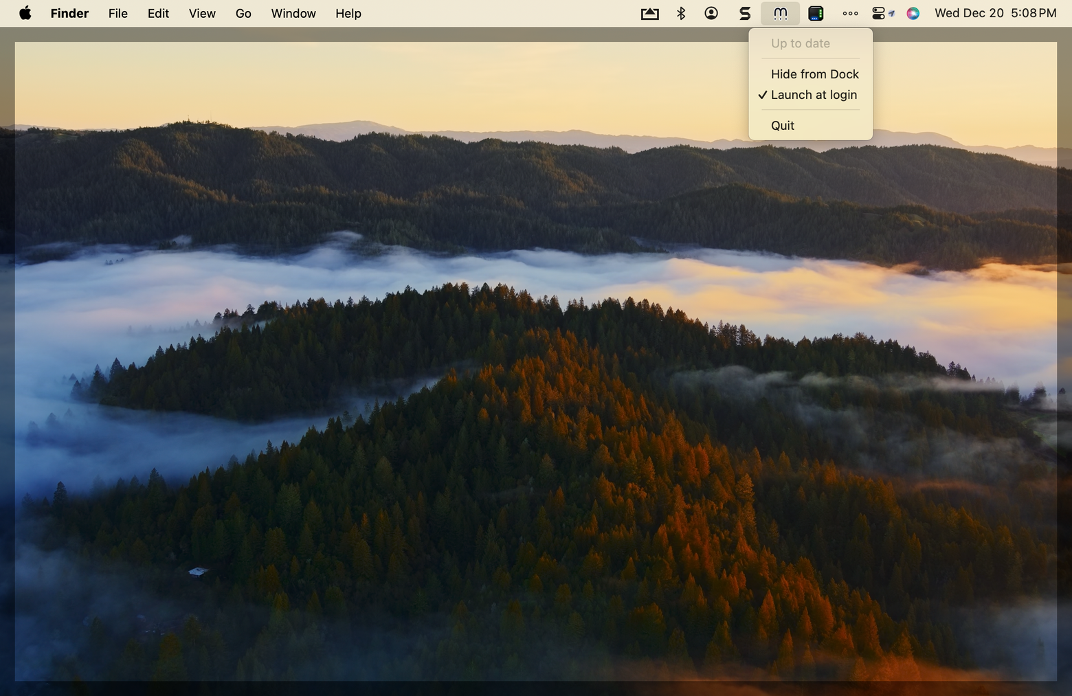 The Mylio icon's menu in the Mac menu bar, showing "Up to date", Hide from Dock, "Launch at login" checked, and Quit.